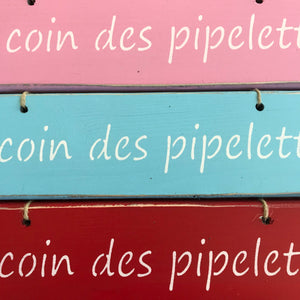 Pancarte:" Le coin des pipelettes".